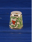 Коллекционный фарфоровый наперсток Perfumed Thimble, выпущенный в 1988 году Thimble Craft специально для Thimble Collector Guild и Scotland Direct. Декорирован золотом 22К.
